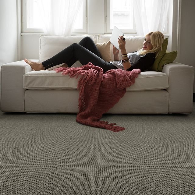 woman laying on sofa with salmon colored blanket from Zinz Design and Selection Center Inc in Austintown, OH