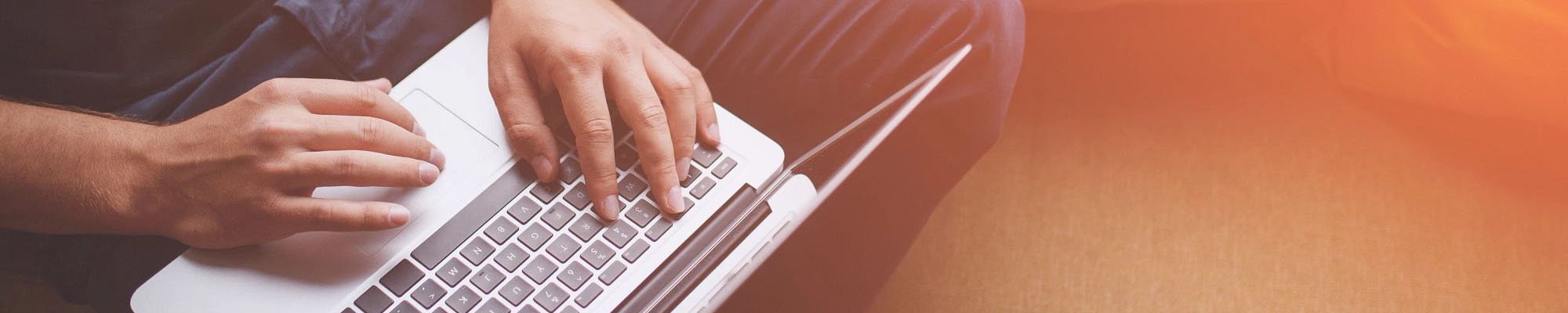 Man writing on laptop - Zinz Design in Youngstown, OH