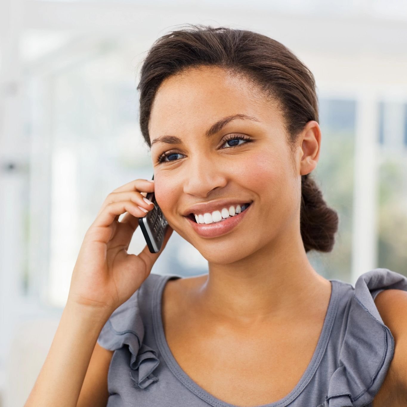 A woman speaks on the phone from Zinz Design and Selection Center Inc in Austintown, OH